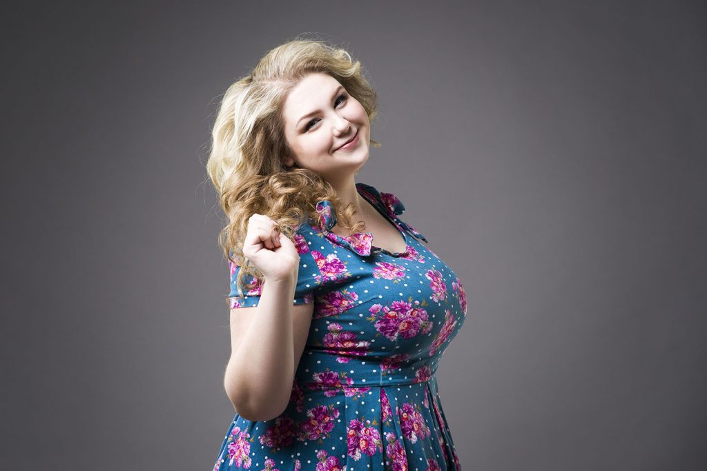 Young beautiful blonde plus size model